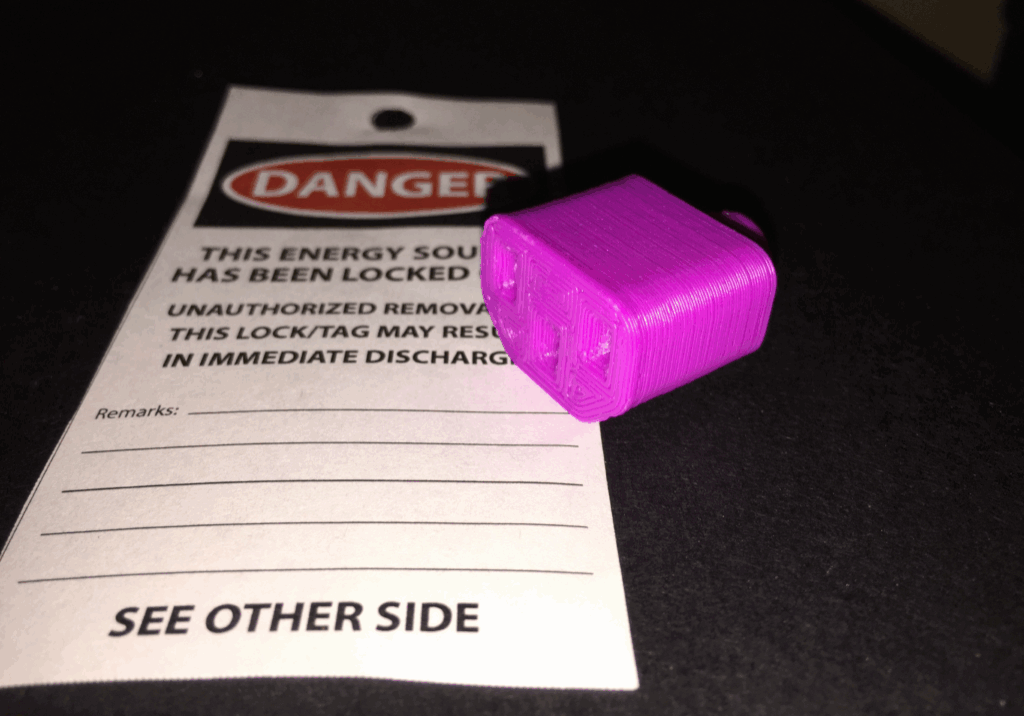 Purple lock on danger warning tag.