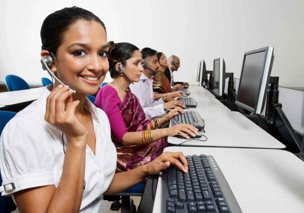 Call center employees working with headsets.