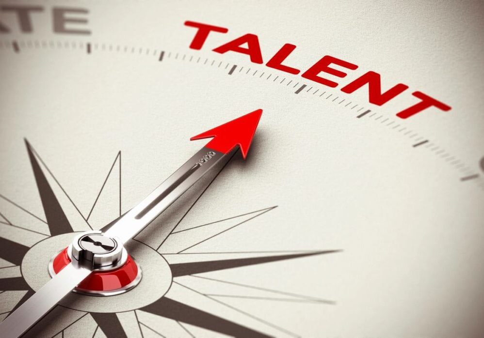 Compass needle pointing towards the word "Talent".